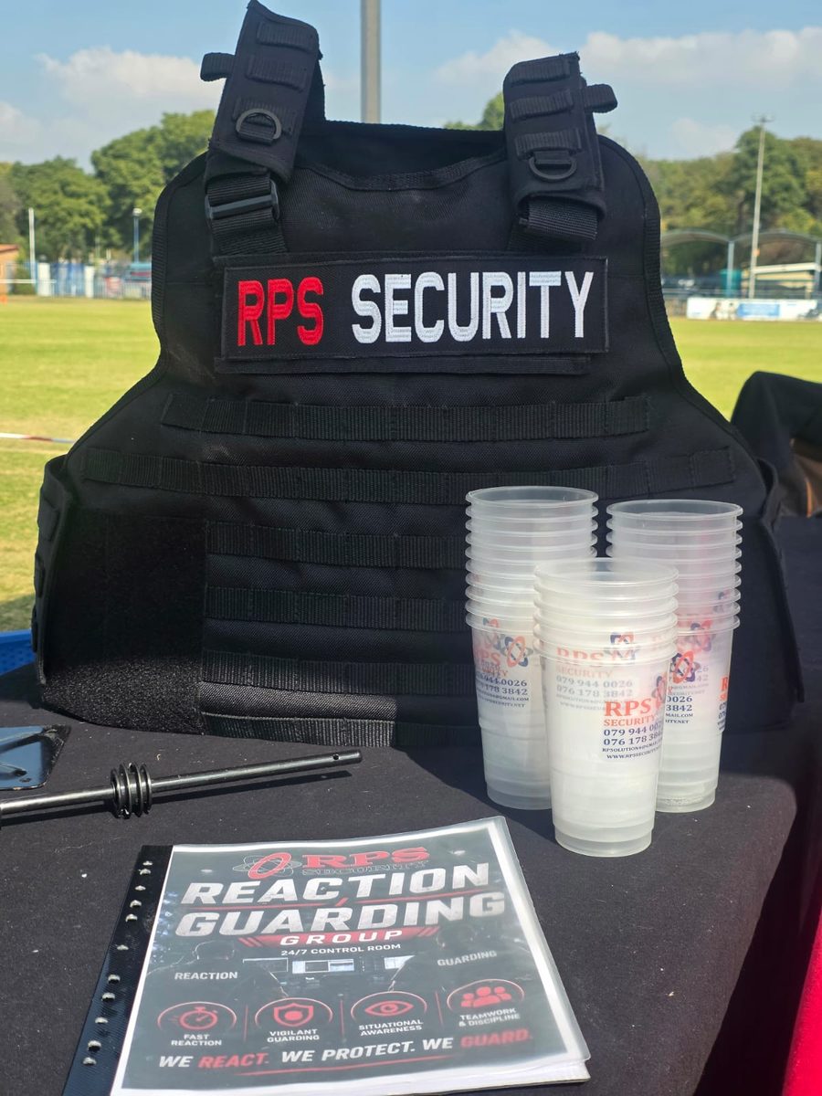RPS Security branded body armour and equipment laid out at a community event
