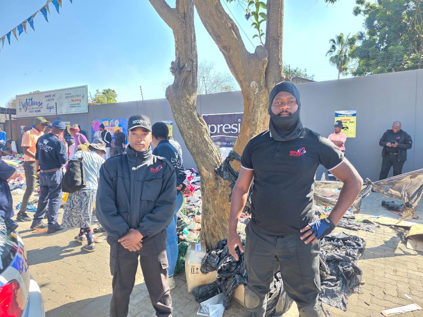 Two RPS Security officers on duty at a community event in Rustenburg