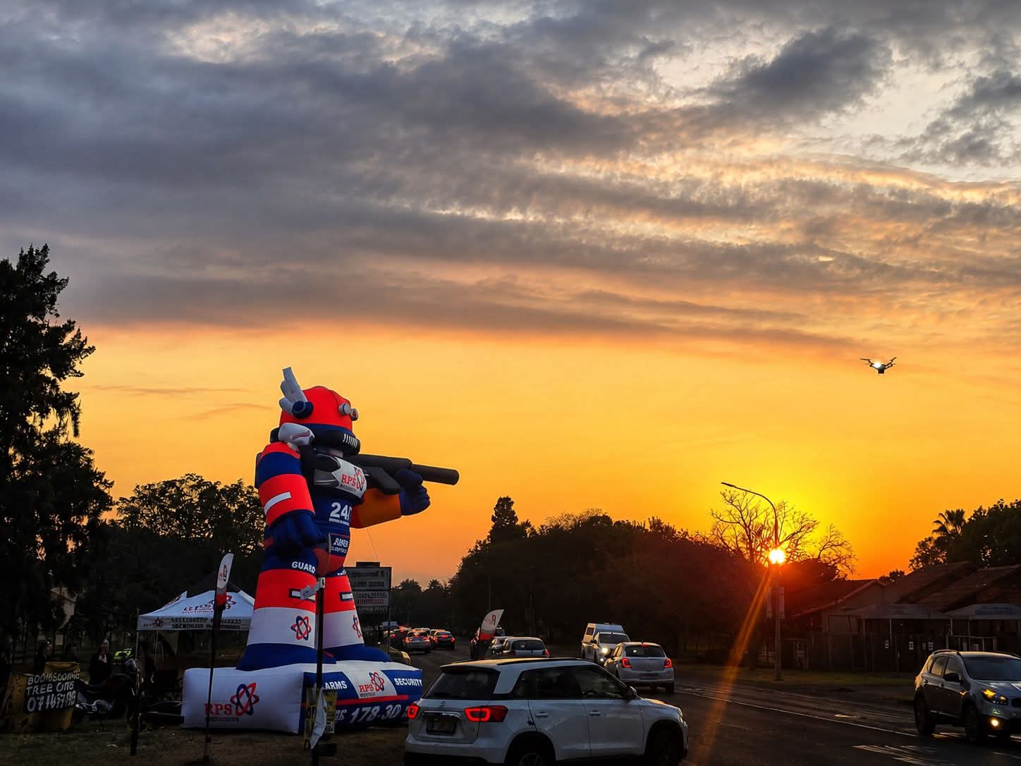 The RPS Security inflatable mascot against a dramatic Rustenburg sunset